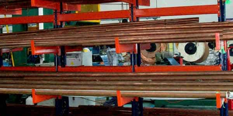 An industrial heavy duty storage rack with iron rods in a warehouse illustrate the usage of heavy duty racks.